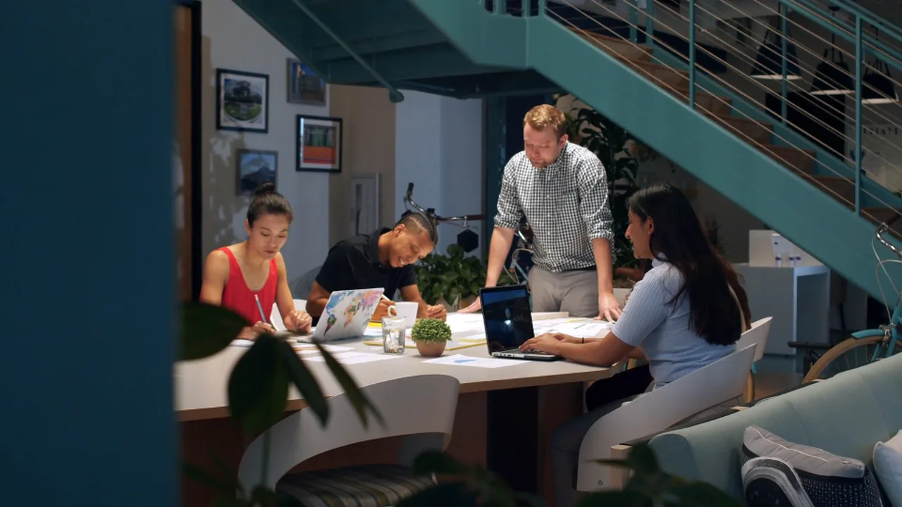 Clinical colleagues working together around a meeting table