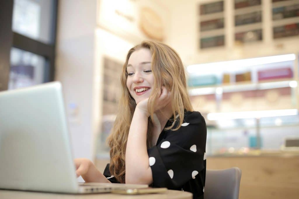 lady looking at her laptop reading services virtual pharmacist provide