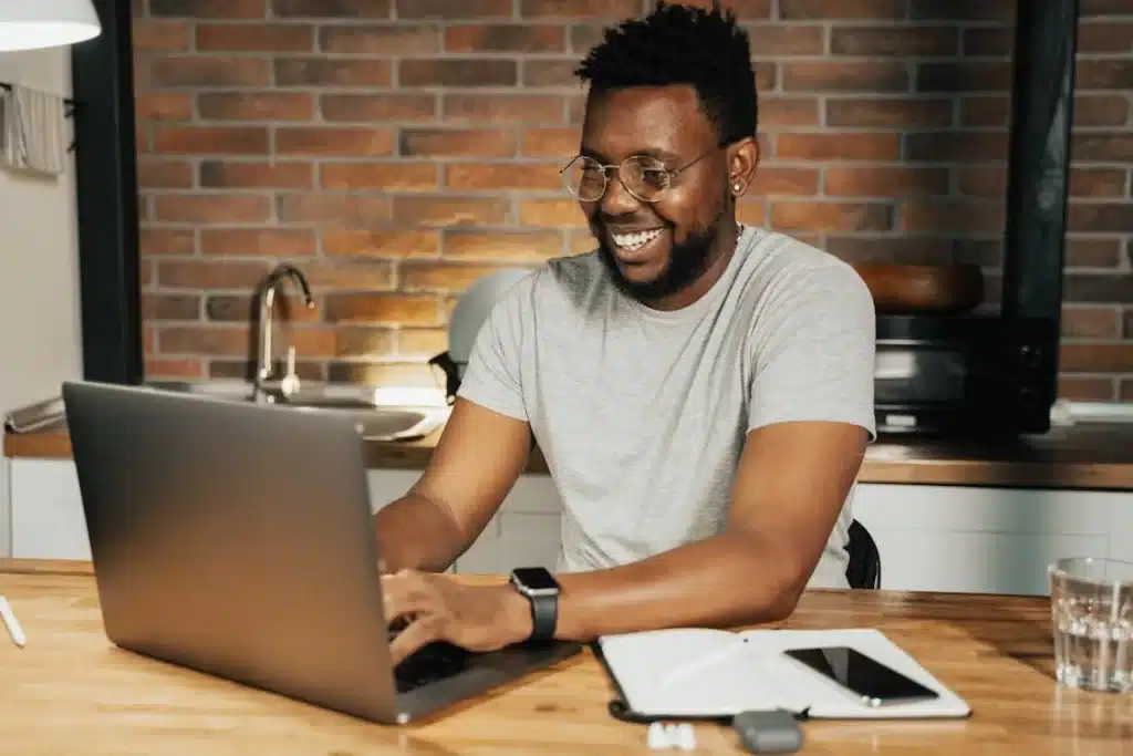 Man looks at laptop, he is looking for pharmacist careers in the pharmacy industry